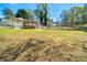 Expansive backyard featuring a wooden deck and plenty of green space, great for outdoor activities at 1755 Fairburn Sw Rd, Atlanta, GA 30331