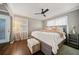 Bright bedroom with hardwood floors, neutral walls, and a comfortable bed with lots of pillows at 1755 Fairburn Sw Rd, Atlanta, GA 30331