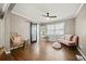 Stylish bedroom with hardwood floors, a sliding barn door, and vintage furniture at 1755 Fairburn Sw Rd, Atlanta, GA 30331