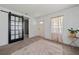 Bright living room with barn door, plush rug, and ample natural light from the window at 1755 Fairburn Sw Rd, Atlanta, GA 30331