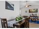 Bright dining room with plank accent wall, stylish decor and hardwood floors at 5720 Crow Dr, Cumming, GA 30041