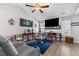 Bright living room featuring vaulted ceilings, wood-look floors, and a fireplace at 5720 Crow Dr, Cumming, GA 30041