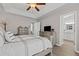 Spacious main bedroom featuring tray ceiling and en-suite bathroom at 5720 Crow Dr, Cumming, GA 30041