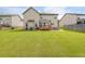 Expansive backyard with a deck, patio, and ample space for recreation at 8097 White Oak Loop, Lithonia, GA 30038