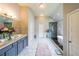 Spacious primary bathroom boasts a double vanity, soaking tub, and glass shower at 8097 White Oak Loop, Lithonia, GA 30038