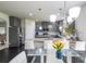 Bright kitchen features stainless appliances, pendant lighting, and an eat-in area at 8097 White Oak Loop, Lithonia, GA 30038