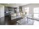 Eat-in kitchen showcasing granite counters, stainless appliances, and modern pendant lighting at 8097 White Oak Loop, Lithonia, GA 30038
