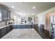 Open concept kitchen with double islands, stainless appliances, and ample counter space at 8097 White Oak Loop, Lithonia, GA 30038