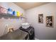 Laundry room featuring new washer and dryer, shelving, and wall decor at 8097 White Oak Loop, Lithonia, GA 30038