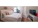 Bright bedroom features a large bed, neutral colors, and a TV at 8097 White Oak Loop, Lithonia, GA 30038