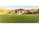Spacious backyard with lush lawn and mature trees, fenced, with house and patio, ideal for outdoor activities at 1250 Great Oaks Se Dr, Conyers, GA 30013