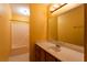 Bathroom with tiled floors and a large vanity with a mirror and good lighting at 1250 Great Oaks Se Dr, Conyers, GA 30013