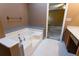 Corner tub and tile flooring with a view into the main bedroom at 1250 Great Oaks Se Dr, Conyers, GA 30013