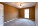 Bedroom with neutral walls, carpet, ceiling fan, and natural light, offering comfort and functionality at 1250 Great Oaks Se Dr, Conyers, GA 30013