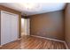 Bedroom with laminate flooring and double door closet at 1250 Great Oaks Se Dr, Conyers, GA 30013