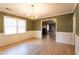 Traditional dining room with wood floors, modern wainscoting, and stylish chandelier at 1250 Great Oaks Se Dr, Conyers, GA 30013