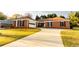 Lovely home with attached garage and long driveway offers easy access and ample parking for residents and visitors at 1250 Great Oaks Se Dr, Conyers, GA 30013