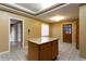 A kitchen with wooden cabinets, a center island and tile flooring at 1250 Great Oaks Se Dr, Conyers, GA 30013