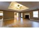 Neutral living room featuring a fireplace, light wood floors, and a ceiling fan, offering a warm, inviting atmosphere at 1250 Great Oaks Se Dr, Conyers, GA 30013