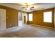 An expansive primary bedroom featuring neutral paint, carpet and multiple windows at 1250 Great Oaks Se Dr, Conyers, GA 30013