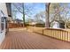 Backyard deck with wooden railings overlooking the detached garage and surroundings at 1569 Montreat Sw Ave, Atlanta, GA 30311