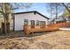 Exterior view of the backyard, including a wooden deck and some trees at 1569 Montreat Sw Ave, Atlanta, GA 30311