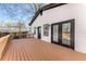 Backyard deck overlooking the yard and trees, adding to the exterior appeal at 1569 Montreat Sw Ave, Atlanta, GA 30311
