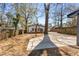 A spacious backyard features a concrete patio and privacy fence, perfect for outdoor activities and relaxation at 1569 Montreat Sw Ave, Atlanta, GA 30311