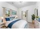 Bright bedroom featuring an ocean themed art piece and hardwood floors at 1569 Montreat Sw Ave, Atlanta, GA 30311