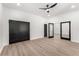 Spacious bedroom with neutral walls, modern ceiling fan, and multiple interior doors at 1569 Montreat Sw Ave, Atlanta, GA 30311