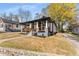 A charming house with inviting front porch, black trim and stone accents offers a warm welcome at 1569 Montreat Sw Ave, Atlanta, GA 30311
