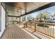 Charming covered porch with wooden flooring and railing, offering a cozy outdoor space with neighborhood views at 1569 Montreat Sw Ave, Atlanta, GA 30311