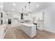Bright open kitchen featuring white cabinets, quartz countertops, and stainless steel appliances at 1569 Montreat Sw Ave, Atlanta, GA 30311
