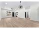 Bright living room with modern light fixture, neutral paint, sleek ceiling fan and contemporary flooring at 1569 Montreat Sw Ave, Atlanta, GA 30311