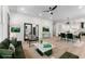 Open living room with modern decor, light wood floors, and views into kitchen and dining area at 1569 Montreat Sw Ave, Atlanta, GA 30311