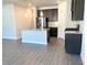 Open concept kitchen with a large island featuring granite countertops and stainless steel appliances at 258 Station Overlook Dr, Auburn, GA 30011