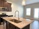 The kitchen includes a stainless steel sink, granite countertops and stainless steel appliances at 258 Station Overlook Dr, Auburn, GA 30011