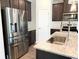 Kitchen with stainless steel appliances, granite countertops and cabinets at 258 Station Overlook Dr, Auburn, GA 30011
