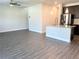 Open floor plan with kitchen island, stainless steel appliances, and ample natural light at 258 Station Overlook Dr, Auburn, GA 30011