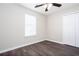 A cozy bedroom featuring a ceiling fan, window, closet and sleek, modern flooring at 4502 Lake Park Dr, Acworth, GA 30101