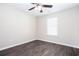 Bright and airy bedroom with hardwood floors and a ceiling fan, providing a comfortable and relaxing space at 4502 Lake Park Dr, Acworth, GA 30101