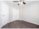 A cozy bedroom featuring a ceiling fan, closet, and sleek, modern flooring at 4502 Lake Park Dr, Acworth, GA 30101