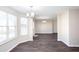 Bright dining area features luxury vinyl plank flooring, neutral paint, and abundant natural light through large windows at 4502 Lake Park Dr, Acworth, GA 30101