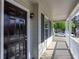 Close-up of front porch, black front door, white railing, and a cozy entrance to the home at 4502 Lake Park Dr, Acworth, GA 30101