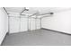 Spacious two car garage with epoxy flooring and ample storage space for vehicles and tools at 4502 Lake Park Dr, Acworth, GA 30101