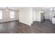 Open living area flows into the kitchen, featuring modern flooring and ample natural light at 4502 Lake Park Dr, Acworth, GA 30101