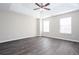 A large main bedroom with a ceiling fan, tray ceilings and ample natural light at 4502 Lake Park Dr, Acworth, GA 30101