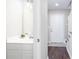Conveniently located powder room with white vanity and decorative mirror near entry, offering practicality and style at 4502 Lake Park Dr, Acworth, GA 30101