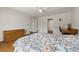 Spacious bedroom with wood floors, dresser, desk, and closet access at 877 Old Farm Walk, Marietta, GA 30066
