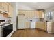 Practical kitchen offering ample cabinetry, lots of counter space, and great natural lighting at 877 Old Farm Walk, Marietta, GA 30066